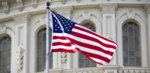US Flag and Capitol Building