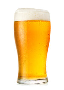 Glass of beer on white background